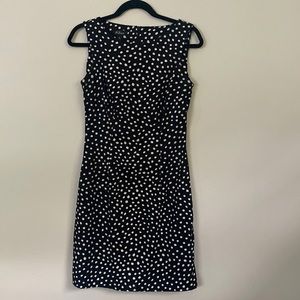Zippered black dress with white polka dots. Fits well for work.